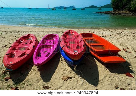 Five Kayak Boats On The Empty Sand Beach In Thailand, Phuket. Sea Horizon In The Gulf. Marina With Y