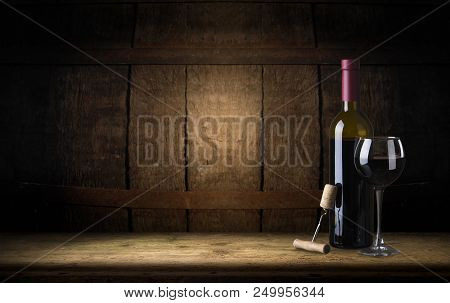 Red Wine. Wine. Bottle And Glass Of Red Wine With Ripe Grapes Still Life. Red Wine Over Black Backgr