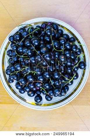 Delicious, Fragrant Black Currant Berries In A Bowl On The Table.