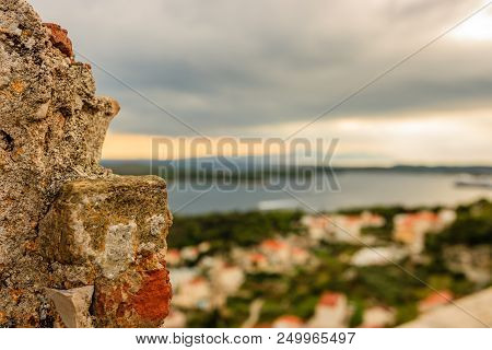 Travel Photo From An Amazing City On Island Hvar, Croatia. Focus On An Old Rock With Paklinski Islan