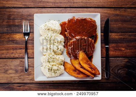Asado Negro With Mashed Potatoes And Fried Plantain