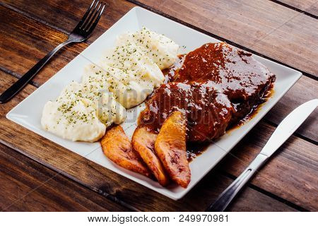 Asado Negro With Mashed Potatoes And Fried Plantain