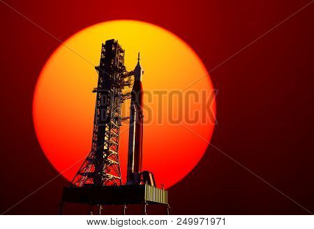Space Launch System On Launchpad On Background Of Red Sun. 3d Illustration.