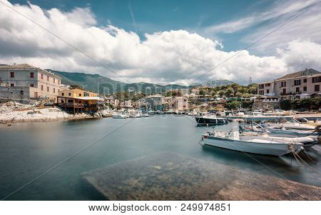 Slow Shutter Image Of Fishing Boats Moored In The Small Harbour At Centuri On Cap Corse In Corsica S