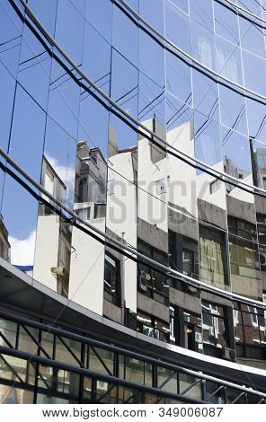 Glazed Building That Generates Strange Reflections Of The Surrounding Buildings, In The Downtown Are