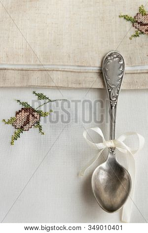 Vintage Russian Silverspoon With Silk Ribbon On Linen Napkin. Old Fashion Heroloom Silverware