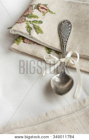 Vintage Russian Silverspoon With Silk Ribbon On Linen Napkin. Old Fashion Heroloom Silverware