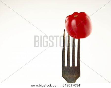 Ripe, red cherry tomatoes of the confetto variety.Isolate.White background