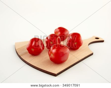 Ripe, Red Cherry Tomatoes Of The Confetto Variety.isolate.white Background