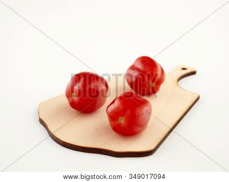Ripe, Red Cherry Tomatoes Of The Confetto Variety.isolate.white Background