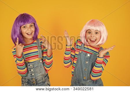 Happy Little Girls. Anime Fan. Cheerful Friends In Colorful Wigs. Anime Convention. Anime Cosplay Pa