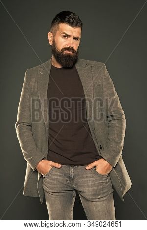Bearded And Barbate. Bearded Man Keeping Arms In Pockets On Grey Background. Bearded Hipster In Casu