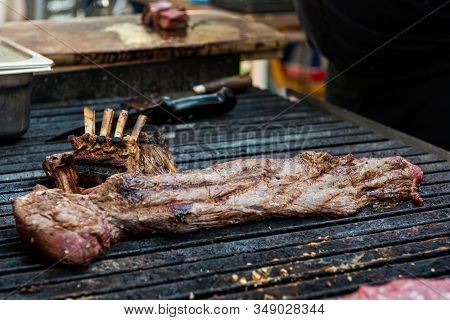 Delicious Piece Of Meat, Striploin On A Charcoal Barbeque.