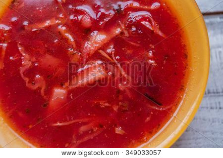 Traditional Ukrainian Russian Vegetable Borscht On The Old Wooden Background. Borscht. Borsch With Q