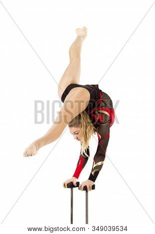 Beautiful Equilibrist In A Red And Black Suit, Performs Exercises On Acrobatic Canes.