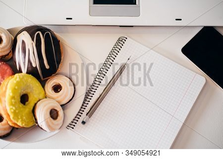 Unhealthy Snack, Compulsive Overeating, Mindless Snacking, Junk Food. Donuts And Cookies At Workplac
