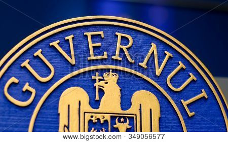 Bucharest, Romania - January 08, 2020: Government logo of the desk from which Romanian Prime Minister Ludovic Orban (not in picture) speaks, at the government headquarters in Bucharest.