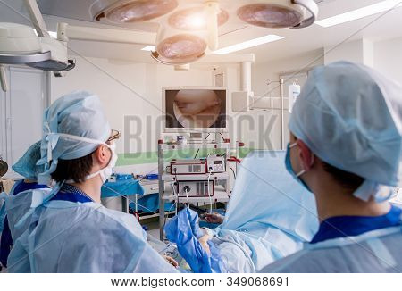 Arthroscope Surgery. Orthopedic Surgeons In Teamwork In The Operating Room
