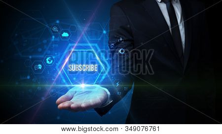 Man hand holding SUBSCRIBE inscription, social media concept
