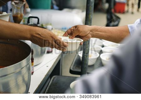 Volunteers Share Food To The Poor To Relieve Hunger : Beggar Begs Food From Donors