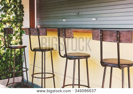 Empty Bar - Bar Stools At The Closed Bar Counter. Small Business Fail Concept