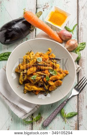 chicken stewed with eggpalnts carrots basil and turmeric spice