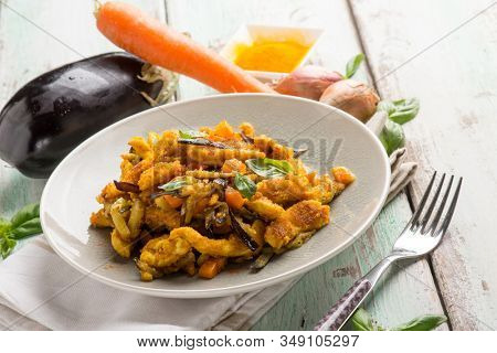 chicken stewed with eggpalnts carrots basil and turmeric spice