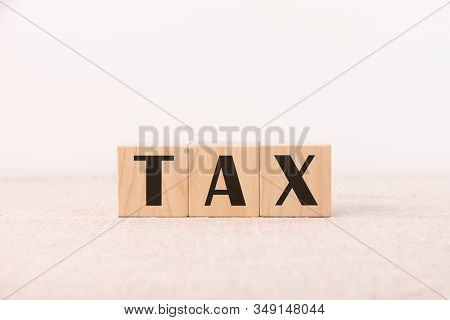Image Of A Tax Word For Various Purposes Of A Tax Return Or Tax Work Or Question On A Light Backgrou