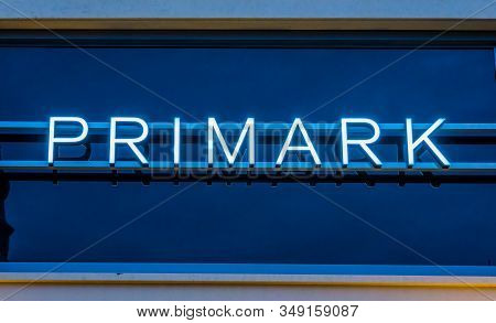 Lighted Primark Neon Sign On A Shopping Window, Exterior Of The Primark Store In Tilburg, The Nether
