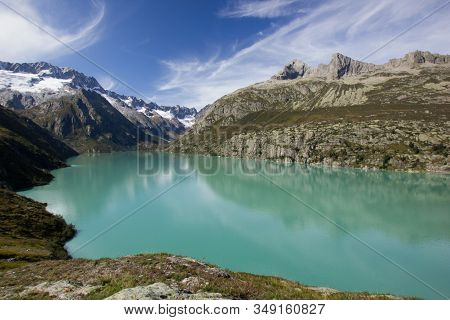 Lake At The Alp Goeschenen With The Dammastock On The Left Side