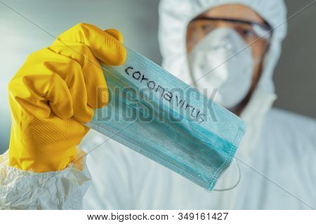 Epidemiologist Holding Coronavirus Respiratory Mask, Close Up