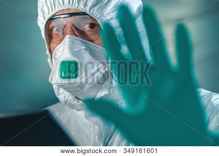 Epidemiologist Gesturing Stop Hand Sign In Coronavirus Quarantine, Selective Focus