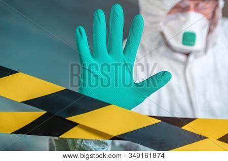 Epidemiologist Gesturing Stop Hand Sign In Coronavirus Quarantine, Selective Focus