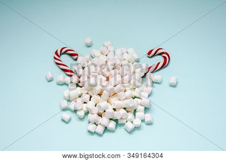 A Bunch Of Marshmallow And Two Candy.blue Back