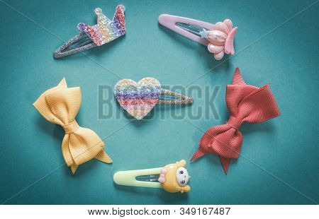Beautiful And Colourful Hair Clips For Kids And Teens On A Plainbackground.