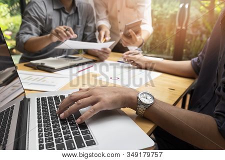 Business Team Meeting And Discussing Project Plan. Businessmen Discussing Together In Meeting Room. 