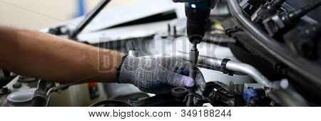 Close-up On Automechanic Hands Checking Automobile Parts. Machine Details Necessarily Used For Perfe