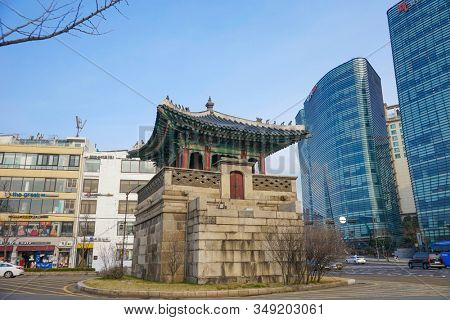 Seoul, Republic of Korea - March 2019: Dongshipjagak, ancient watchtower, Seoul landmark. Modern office buildings in the background.