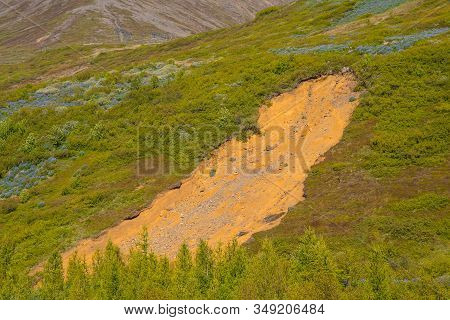 Landslide Near Town Of Reydafjordur In East Iceland On A Sunner Day