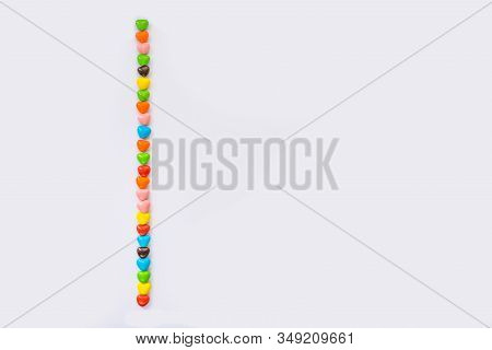 Valentines Card Background - Small Multi Colored Heart-like Candies Are Decorated In The Shape Of On