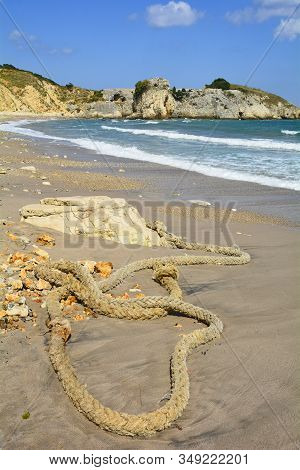 An Old Rope On The Beach On The Black Sea Coast At Kilimli Bay, Near Agva, Sile, In North West Turke