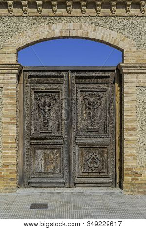 Old Massive Wooden Door Of La Giralda In Arboc, Province Of Tarragona. Spain.