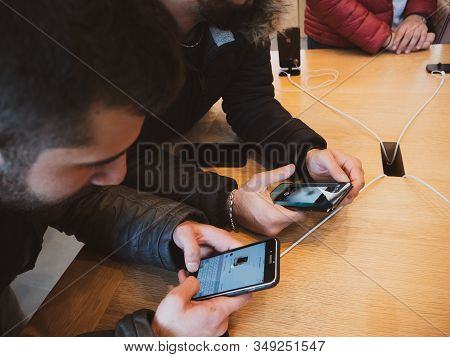 Paris, France - Nov 3, 2017: Overhead View Of Men Customers Admiring Inside Apple Store The Latest P
