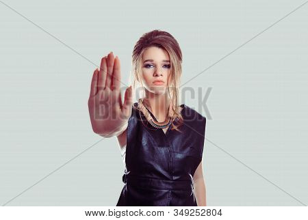 Stop Right Here. Angry Annoyed Displeased Young Woman Raising Hand Up To Say No, Stop Isolated Light