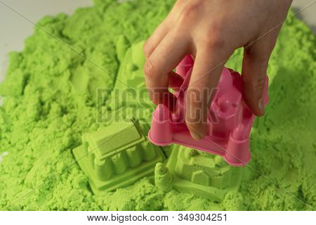 Kinetic Sand. A Child Plays With Kinetic Sand. Fine Motor Skills, Creativity, Games