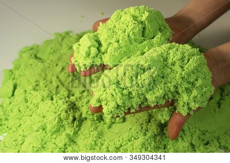 Kinetic Sand. A Child Plays With Kinetic Sand. Fine Motor Skills, Creativity, Games