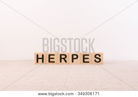 Herpes Word Concept On Wooden Cubes And Light Background
