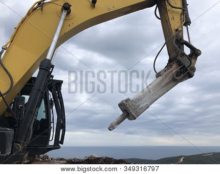 Hydrohammer During Road Construction Works On The Rocky Soils.