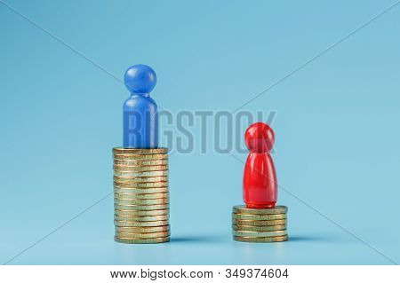 A Blue Successful Businessman With A Large Profit On A Stack Of Gold Coins And A Red Less Successful