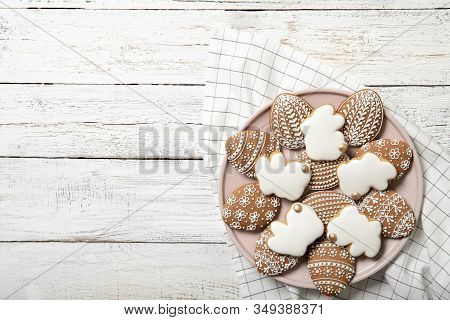 Easter Cookies On A Plate On A Wooden Background. Easter Bunnies. Place For Text. Easter Eggs